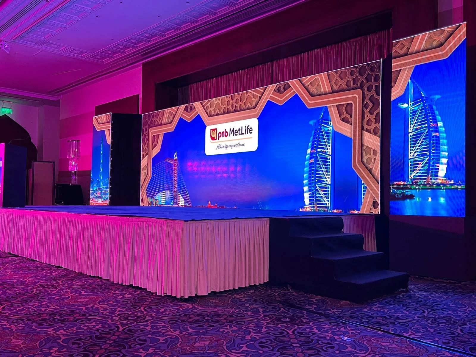 Corporate presentation stage with scenic fabrication and lighting