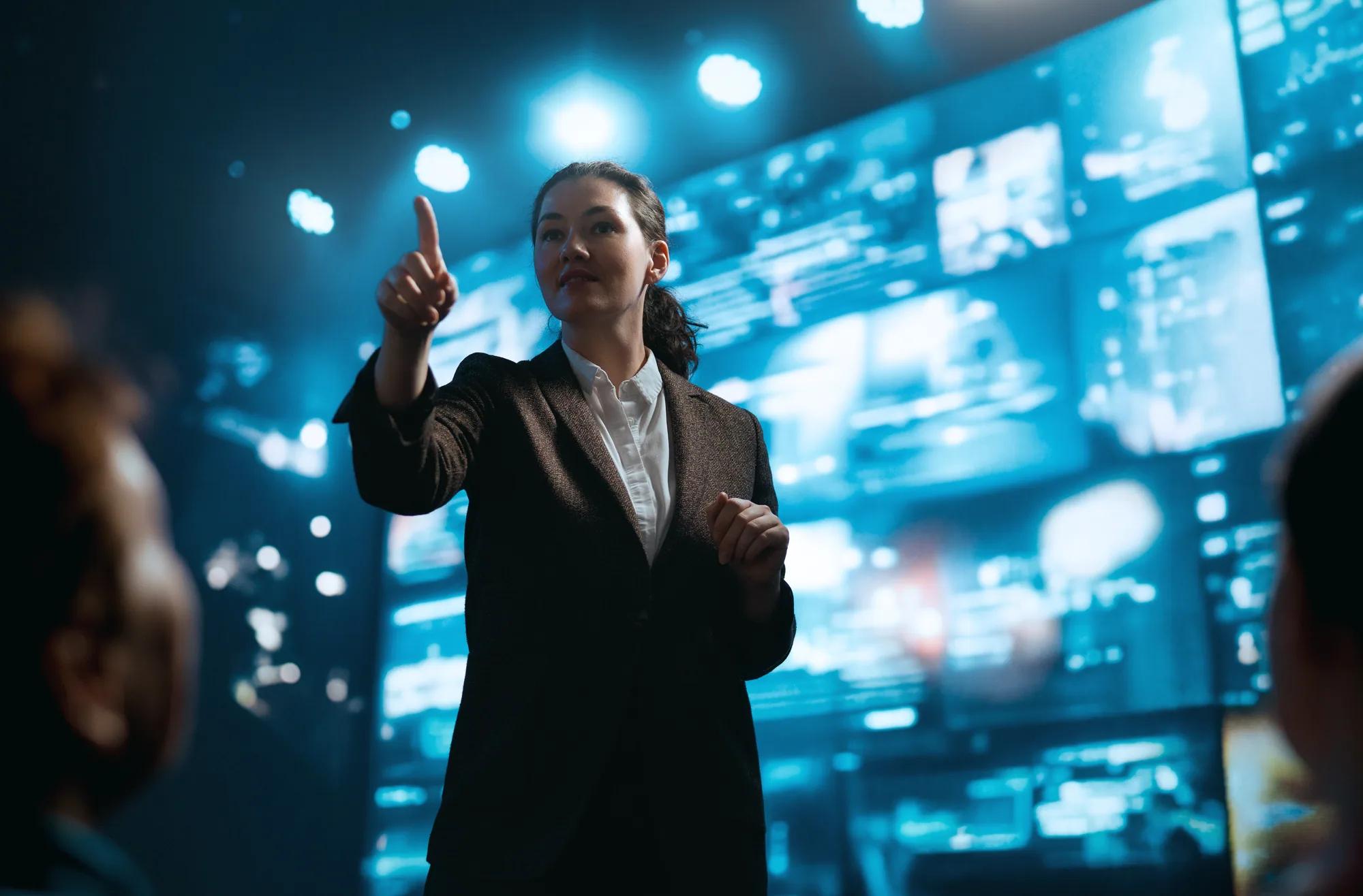 Speaker addressing an audience from a conference stage
