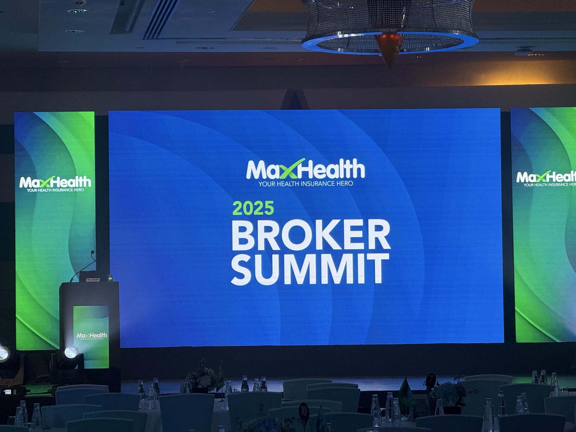 Conference stage with wide LED content and theatrical lighting